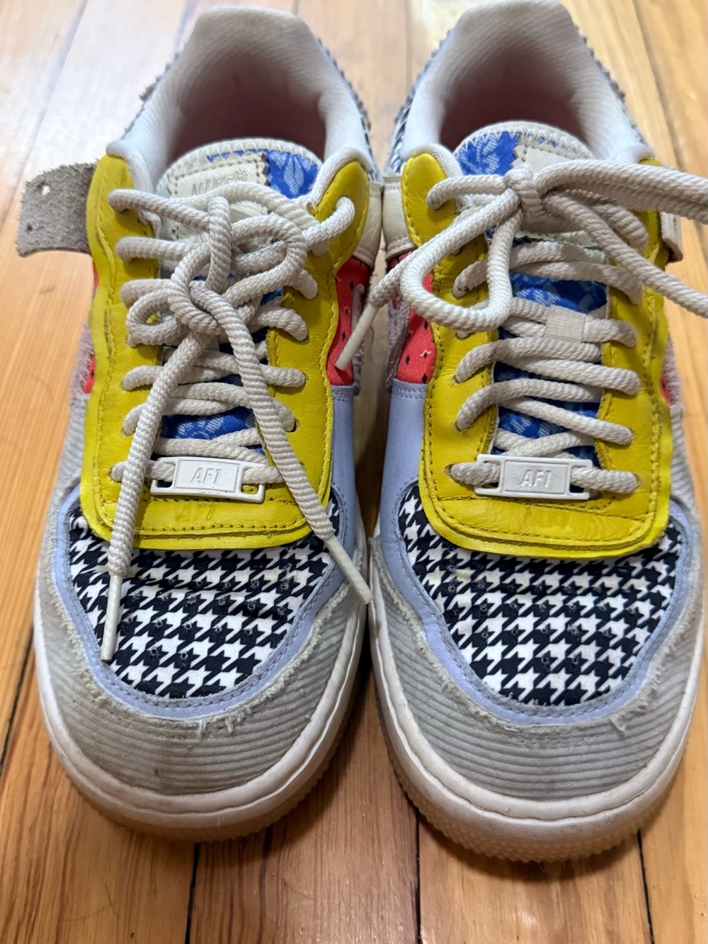 Nike Kids Sneakers in Yellow, Black & White with Blue and Red Accents